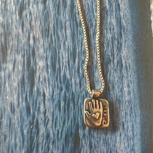 16 inch sterling silver chain and create charm by Amy Peters.